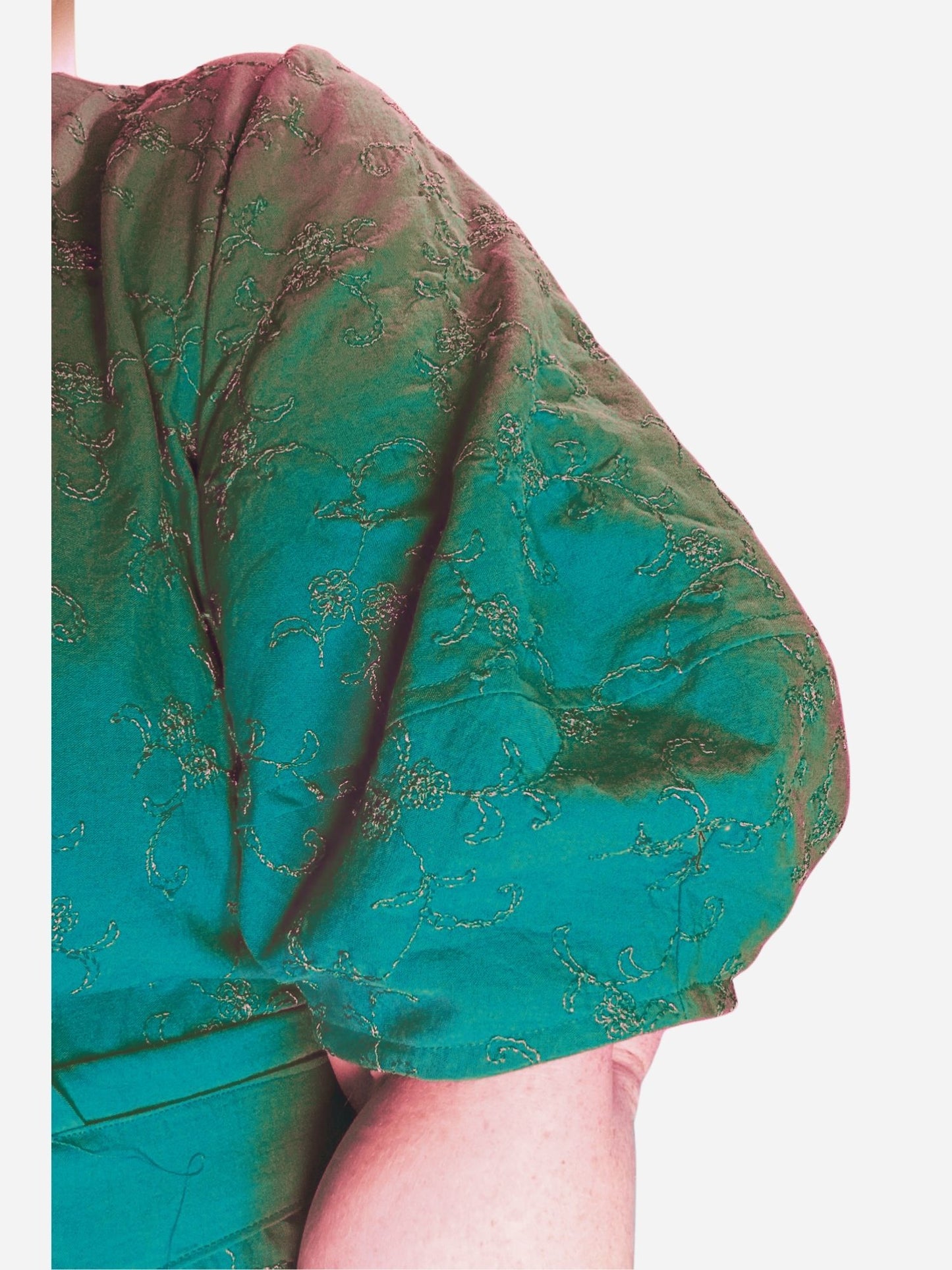 Close-up of a pink textured garment with a blurred background